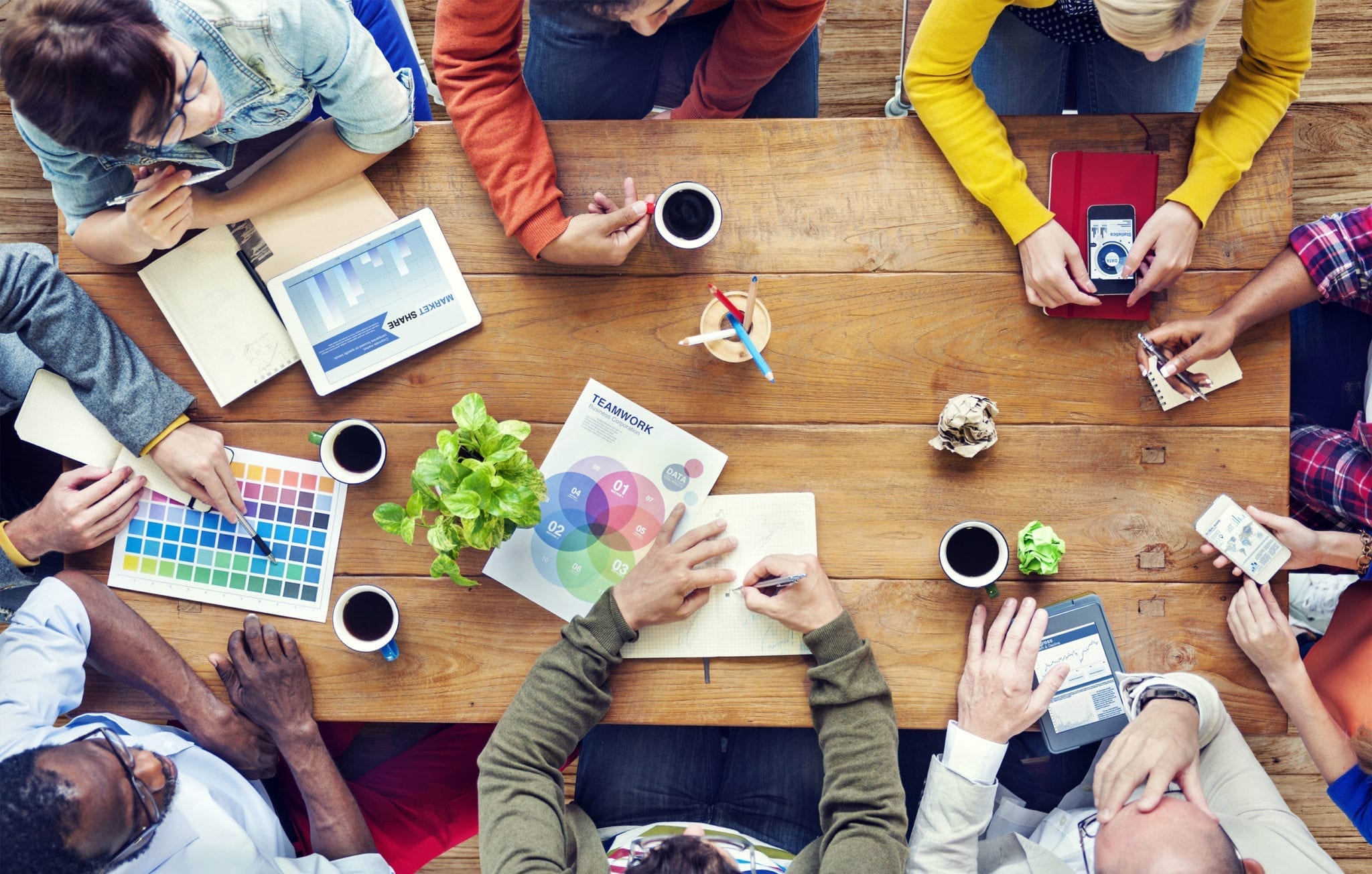 Long Island digital marketing employees gathered around table