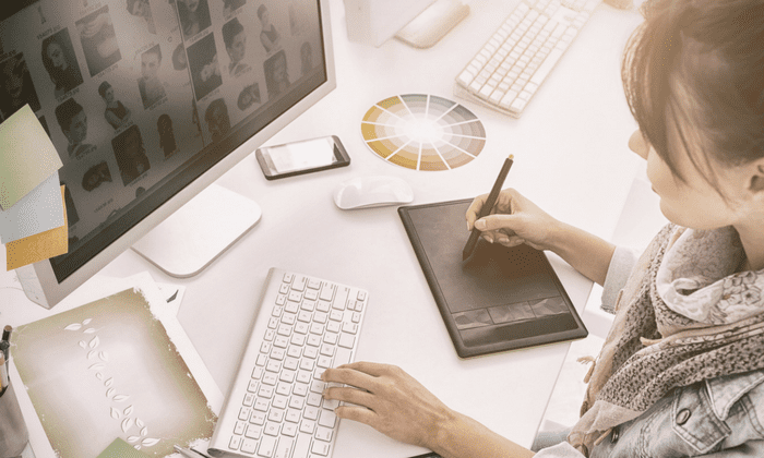 female graphic designer working on her computer