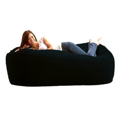 woman on large bean bag bed