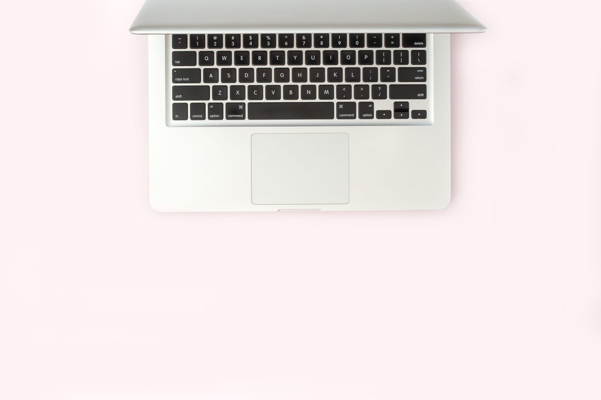 Long Island Blogging Services - 7 Steps to Blog Writing Success - Laptop on pink backdrop