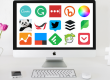 desktop computer with top web tool icons on monitor screen